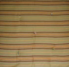 close-up of green and brown stripped mattress