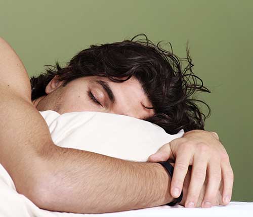 Man sleeping, head on pillow