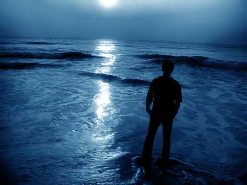 Parasomnias - Man Walking on Beach Under Blue Moonlight