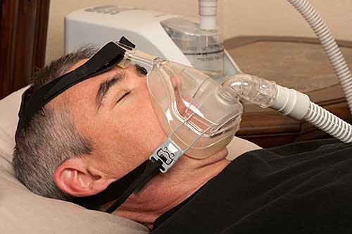 Man with CPAP machine