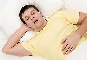 Man sleeping with mouth wide open.